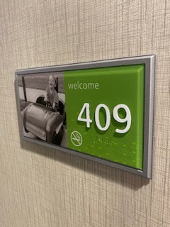 ADA sign green color for hotel in NJ