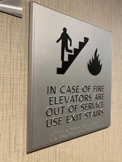 ADA Sign made of silver material in elevator in a hotel in NJ