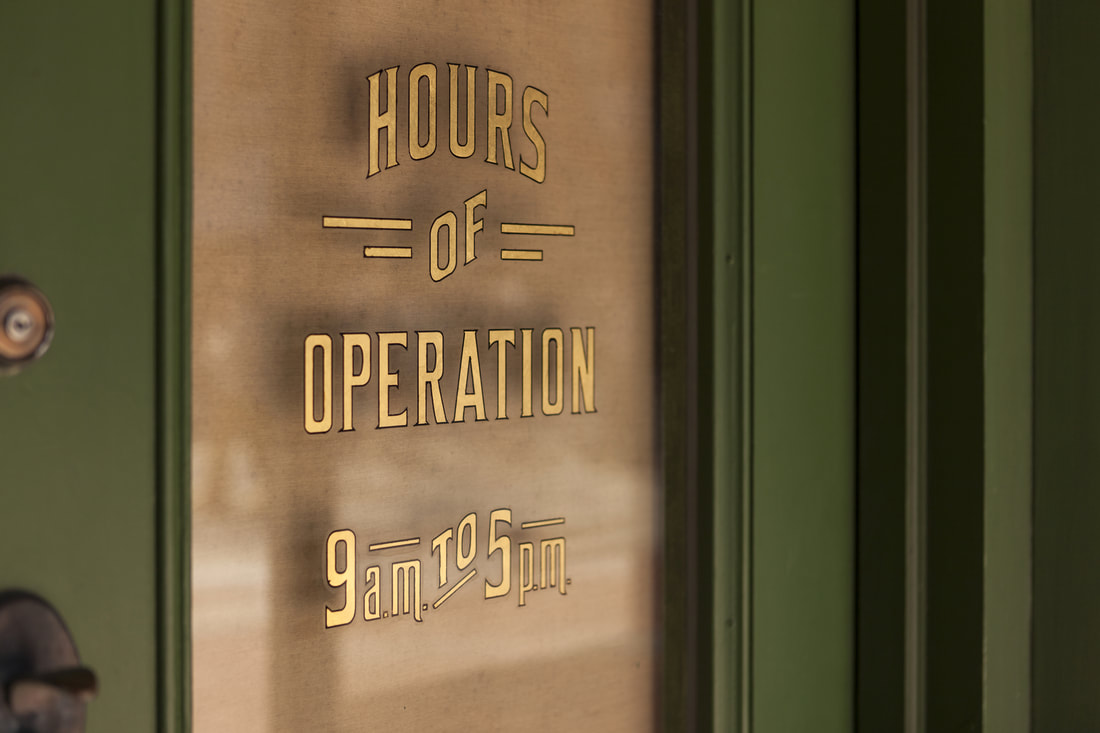 Hours of operation sign using window graphics