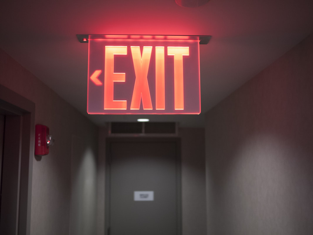 Red Exit sign for a hotel in NJ